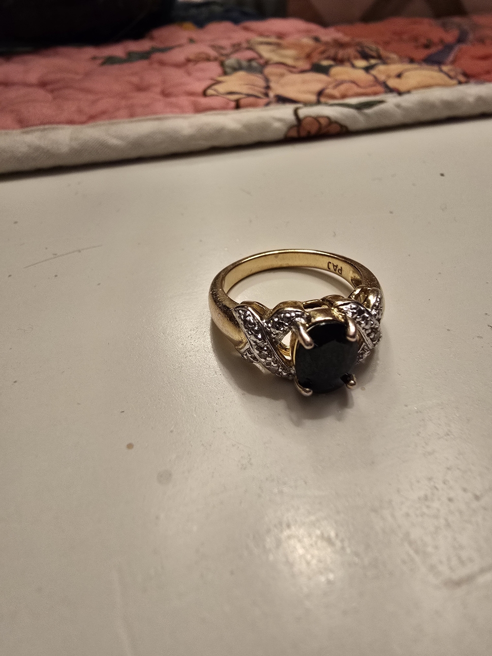 Gold-Tone Ring with Dark Blue Sapphire Center Stone and Diamond Accents